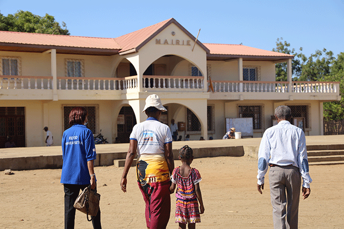 People walk towards a court of justice