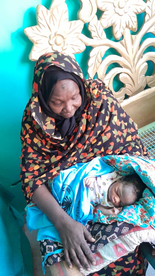 A midwife cares for a newborn child.