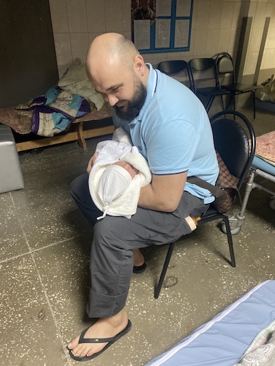 Man holding baby