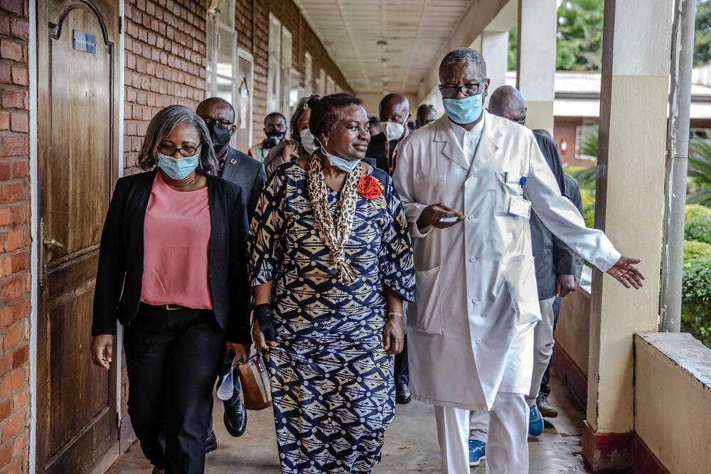 Woman and doctor walking 