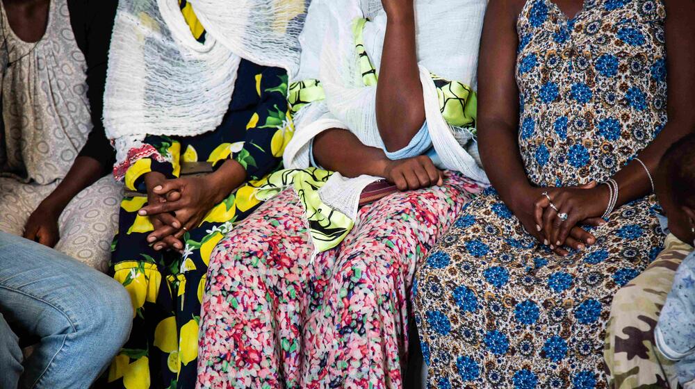 A group of women sit together.