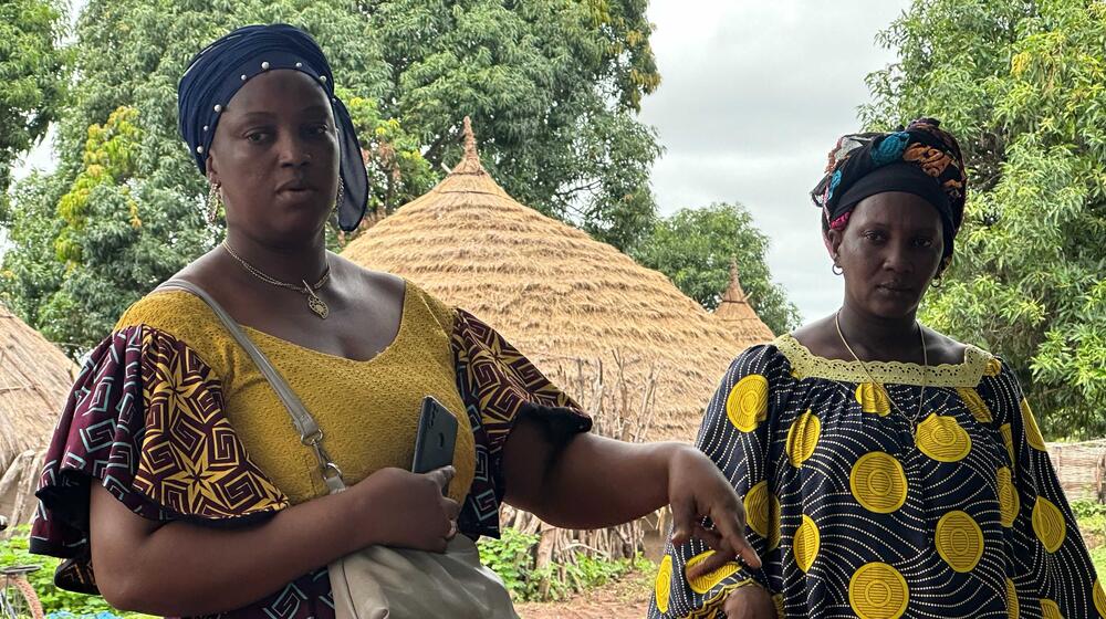 Two women standing.