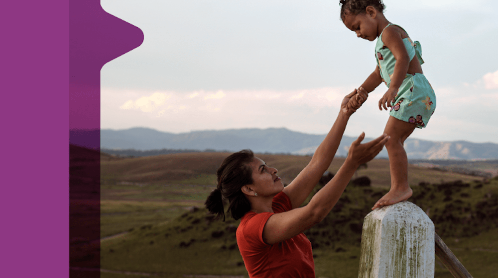 A mother plays with her young child. 