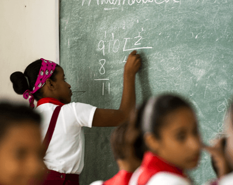 Girls study math at school.