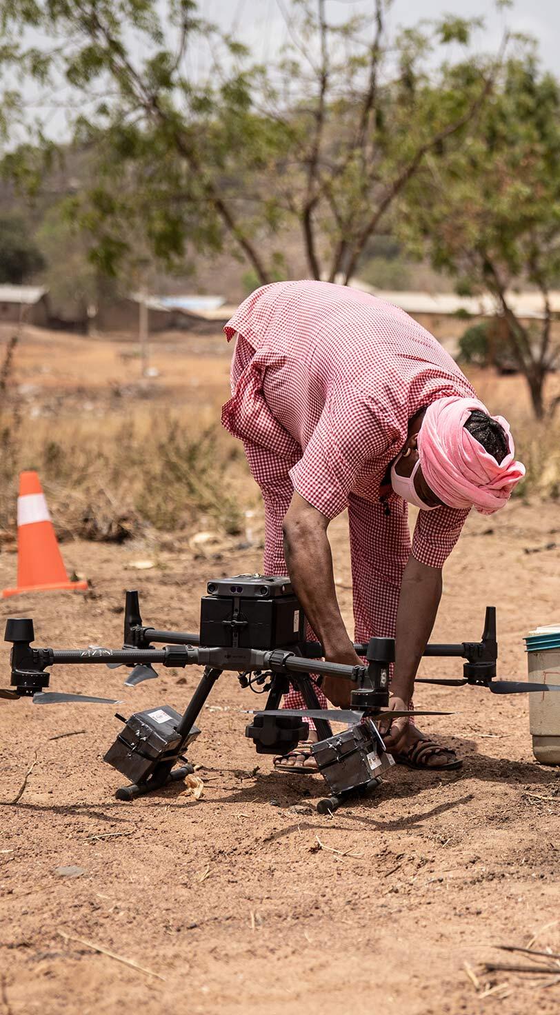 Health innovations, like the rapid development of COVID-19 vaccines, also proved essential in 2021. Here, in Benin, midwives offload medical supplies from a drone in the Firou maternity health centre, part of a pilot programme to deliver vital medicines and blood to isolated areas.