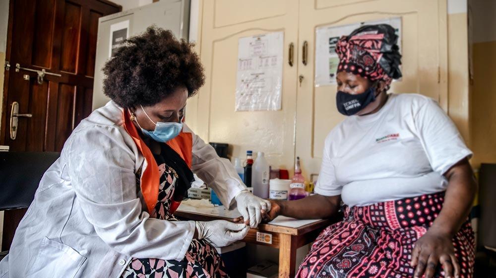 A woman receiving a health service