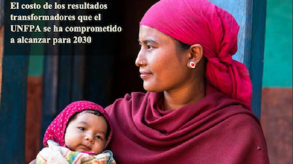 Mother with pink headscarf holds sleeping baby and looks into the distance