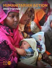 Young woman in a pink headscarf holding a baby