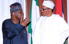 Nigeria's President Muhammadu Buhari chats with Dr. Babatunde Osotimehin, UNFPA's Executive Director